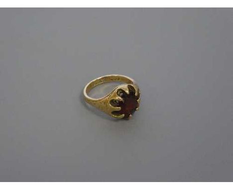 A 9ct gold garnet set ring, size M, 6.1g.