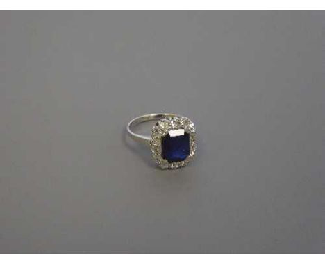 An 18ct white gold sapphire and diamond cluster ring