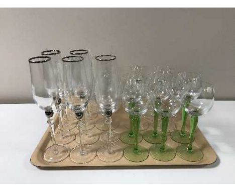 A tray of assorted glassware together with three lead crystal decanters with stoppers