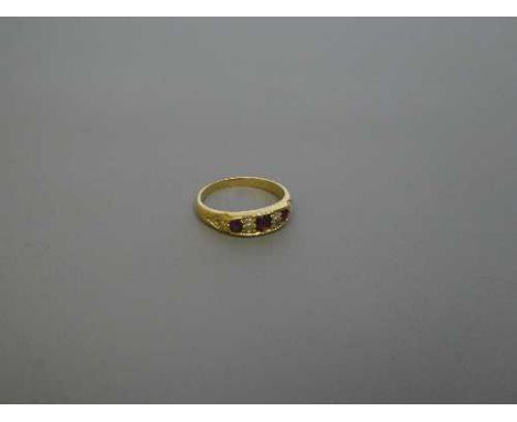 An 18ct gold ruby and diamond ring, size N, 3.9g, 