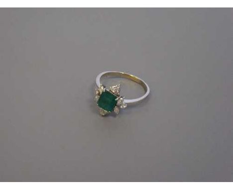 An 18ct gold emerald and diamond ring