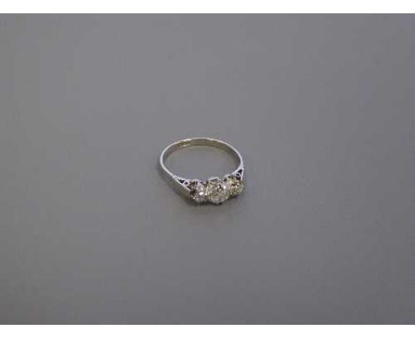 A platinum three stone diamond ring