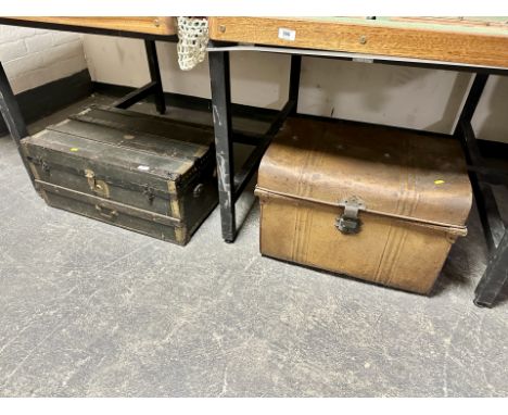 A tin trunk together with a further wooden bound trunk 