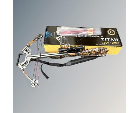 A Titan 200lb draw weight crossbow with several bolts, telescopic sight, skelton stock in camo pattern, with box. 