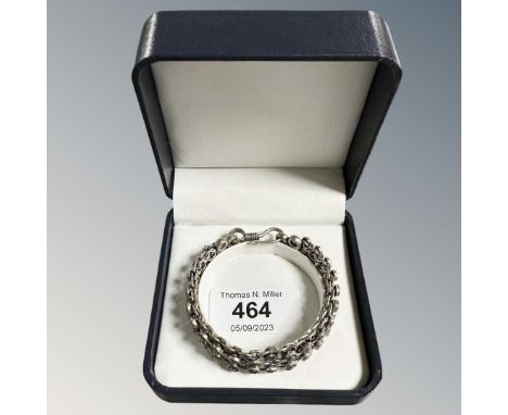 A boxed double row silver daisy bangle, 31g