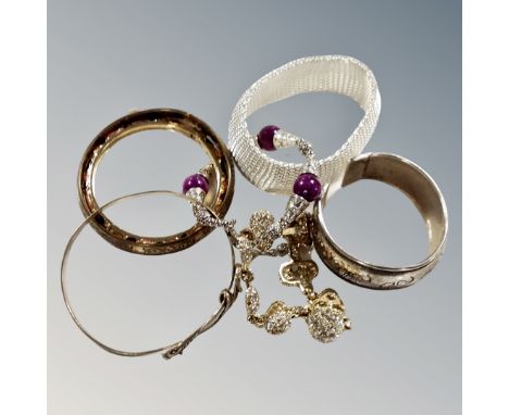 A white metal mesh bracelet, bangle, skull bracelet etc 