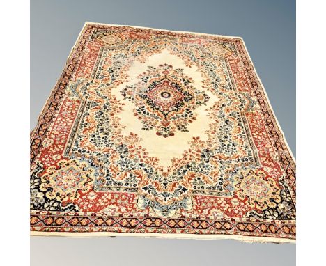 A machine made Persian designed carpet, 342 cm x 248 cm  CONDITION REPORT: Some wear to pile 