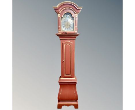 A Continental red and gilt longcase clock with pendulum - no weights 