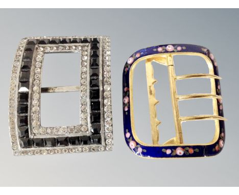 A yellow metal buckle with floral and blue enamel decoration, plus on other