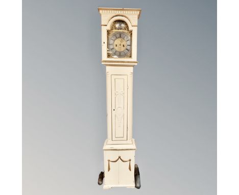 A continental cream and gilt longcase clock with brass and silvered dial, pendulum and weights 