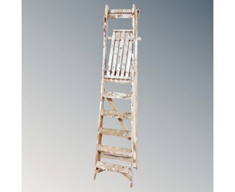 A set of folding wooden step ladders 
