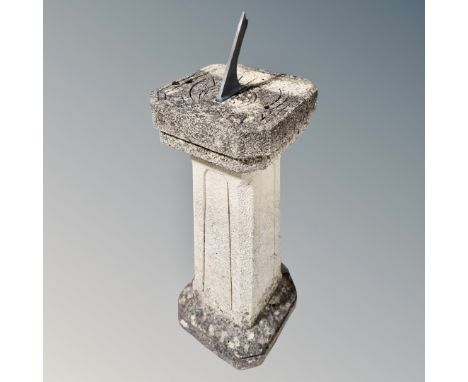 A stone column sundial, 34cm wide by 34cm deep by 96cm high.