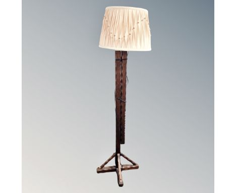 A rustic pine extending floor lamp with shade 