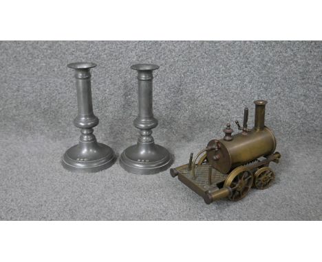 A pair of John Somers pewter candle sticks, impressed with makers mark along with an early 20th century model brass steam eng