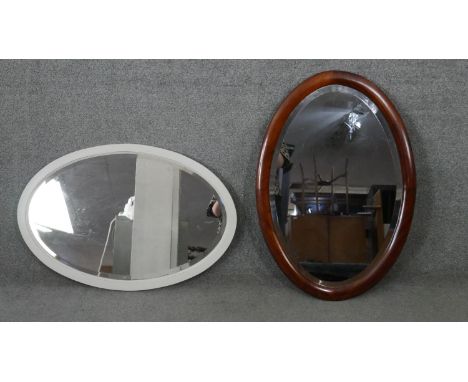 An early 20th century mahogany framed wall mirror with bevelled plate and a similar painted mirror. H.83 W.57CM (largest) 
