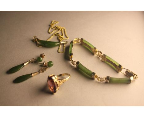 A gilded metal Chinese spinach jade necklace, bracelet and earring set along with a purple paste and 9 carat yellow gold dres