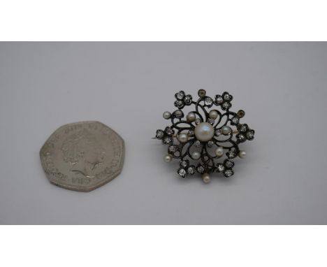 A Victorian metamorphic yellow and white metal (tests as 9ct and silver) floral and clover design pearl and diamond brooch/pe