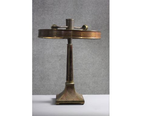 A vintage rosewood and brass inlaid table lamp with twin light fittings. H.46 Dia.36 cm.