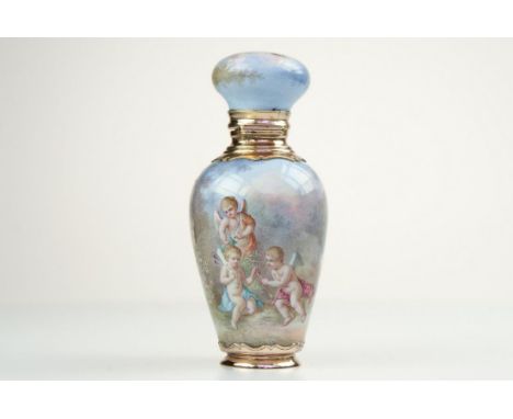 The scene is two cherubs making arrows for cupid who is hovering above them. 8cm ht, diam 3.3cm. 18ct gold mounted. No marks.