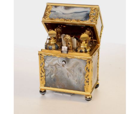 Fully fitted with four perfume bottles 2 of which are agate caged in gold the other two crystal gold mounted , a gold patch b