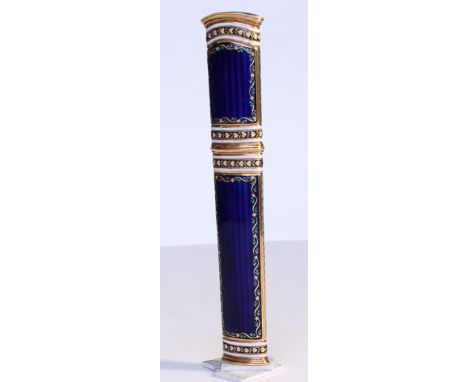A Gold &amp; enamel wax case. the blue enamel panels over an engine turned background, the blue panels bordered with leaves, 