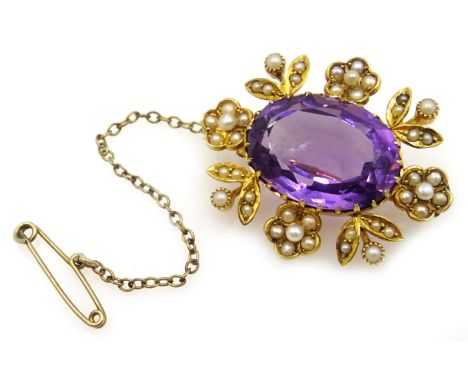 Victorian 15ct gold (tested) oval amethyst and seed pearl flower design brooch Condition Report Approx 9.1gm, length = 32mmCl