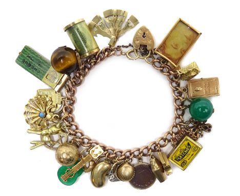 9ct rose gold bracelet with unusual gold charms including matchbox, driving license, cheque book, pearl shell, fan, accordion