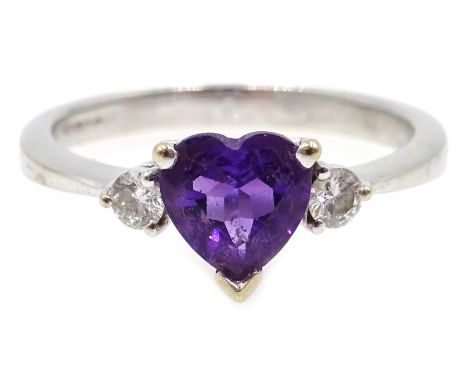 Heart shaped amethyst and diamond ring hallmarked 18ct  Condition Report amethyst  N-O 2.9gmdiamond L 2.4gmClick here for fur