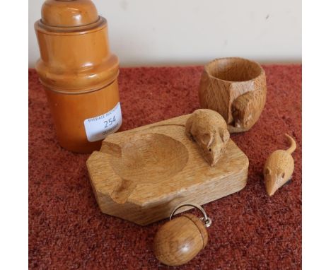 Tureen canister with turn off top, a Robert Thompson 'Mouseman' oak napkin ring and ashtray, carved oak keyring pendant and s