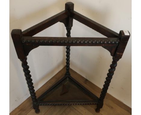 Early - mid 20th C oak corner stick stand on barley twist supports, with lift out metal tray 