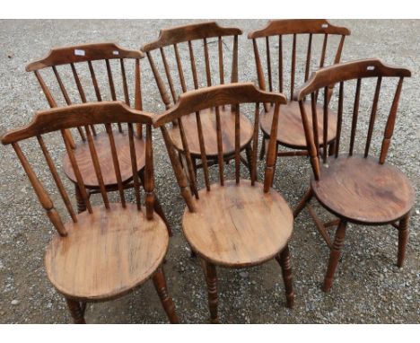 Set of six early 20th C elm stick back dining chairs with circular seats 