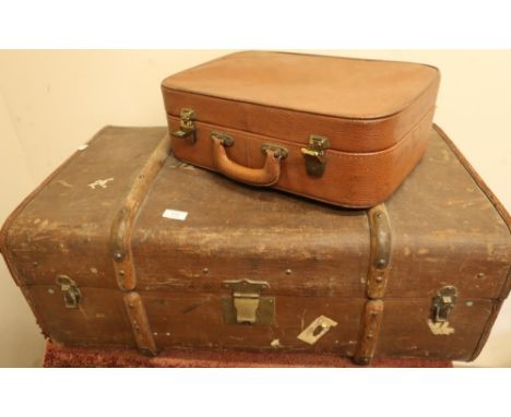 Vintage wooden bound travelling trunk with stencilled painted detail and Stork logo with various luggage label tickets, and a