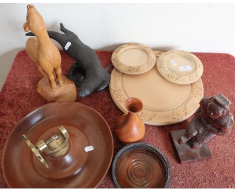 Three carved wood bread/cheese boards, nut bowl and cracker, various carved wood and other figures 