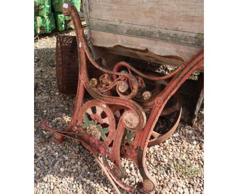 Pair of Victorian cast metal bench ends with Greek key border and thistle and rose pattern 