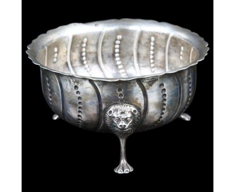 A George III Irish silver sugar basin, relief embossed spiral decoration with lion mask feet, maker's marks HG, hallmarks Dub