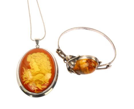 An Art Nouveau Continental silver and amber torque bangle, and a similar intaglio pendant necklace, bangle internal circumfer