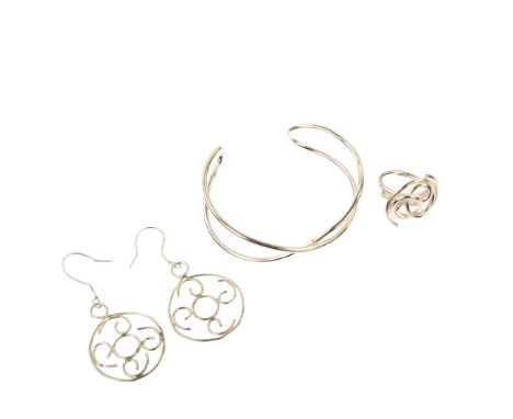 A handmade sterling silver abstract demi-parure, comprising ring, cuff bangle and pair of drop earrings, by Claude Wilkes, ri