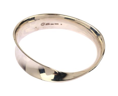 GEORG JENSEN - a mid-20th century Danish modernist sterling silver Mobius bangle, of tapering and folded loop form, designed 