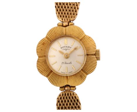 ROTARY - a lady's Vintage 9ct gold mechanical wristwatch, silvered dial with gilt baton hour markers, flowerhead case and 9ct