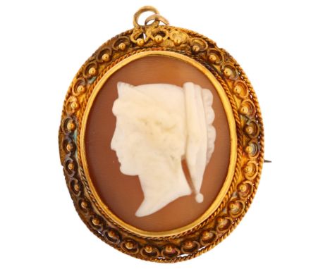 A Victorian shell cameo brooch, relief carved depicting Classical female profile, in unmarked gold Etruscan Revival frame, br