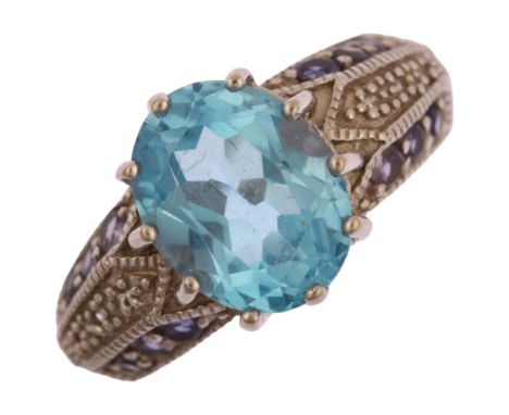 A modern Thai 9ct white gold blue topaz tanzanite and diamond ring, setting height 10.8mm, size L, 4.1gNo damage or repair, a