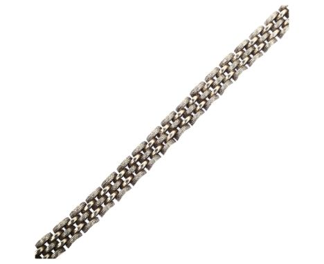 CREOLE/PER NILSON - a Danish sterling silver gatelink bracelet, domed form with textured and polished decoration, length 18.5