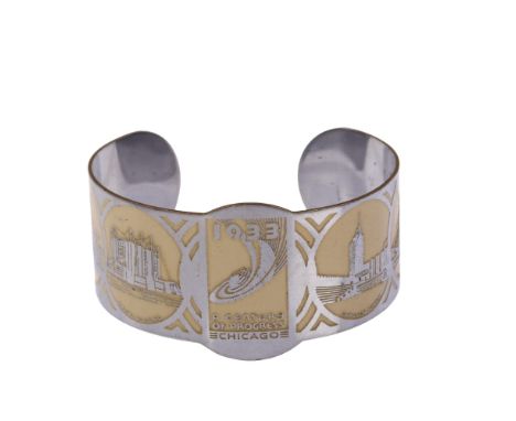 An Art Deco chrome plated 1933 Chicago World Fair cuff bangle, depicting various scenes, including Maya Temple, Golden Pavili