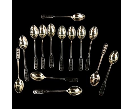 EGON LAURIDSEN - a set of 14 Danish vermeil sterling silver and black enamel shamrock coffee spoons, length 10cmNo damage, no