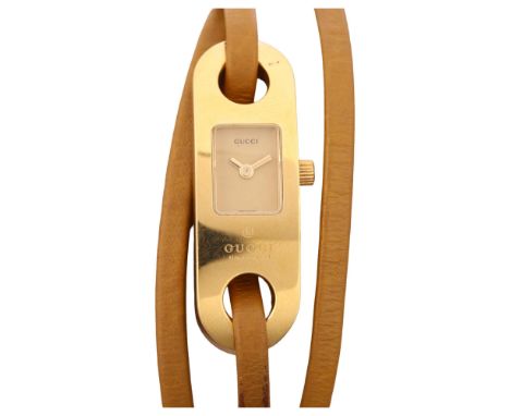 GUCCI - a lady's gold plated stainless steel 6100L quartz wristwatch, champagne dial with leather wrap-around strap, serial n