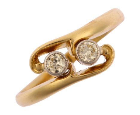 An early 20th century 18ct gold two stone diamond crossover ring, platinum-topped set with modern round brilliant-cut diamond