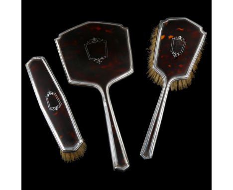 An Art Deco George V silver and tortoiseshell pique inlaid 3-piece dressing table set, comprising hand mirror, hair brush and