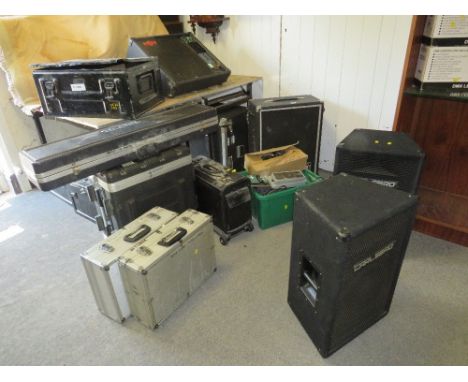 A large quantity of audio equipment to include monitors, amps, a pair of Carlsbro speakers and metal military containers with