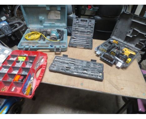 A selection of 4 tool boxes and contents to include a Makita 110v breaker drill and a cordless wolf screwdriver/drill
