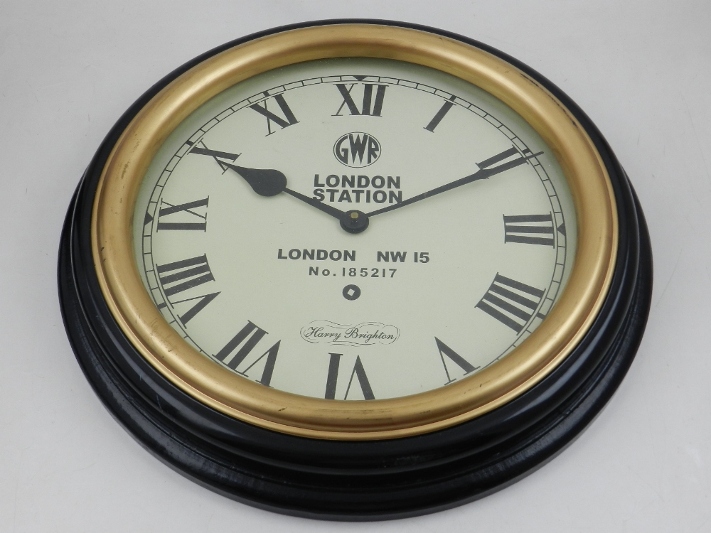A Harry Brighton 'London station' wall clock, the white dial with Roman